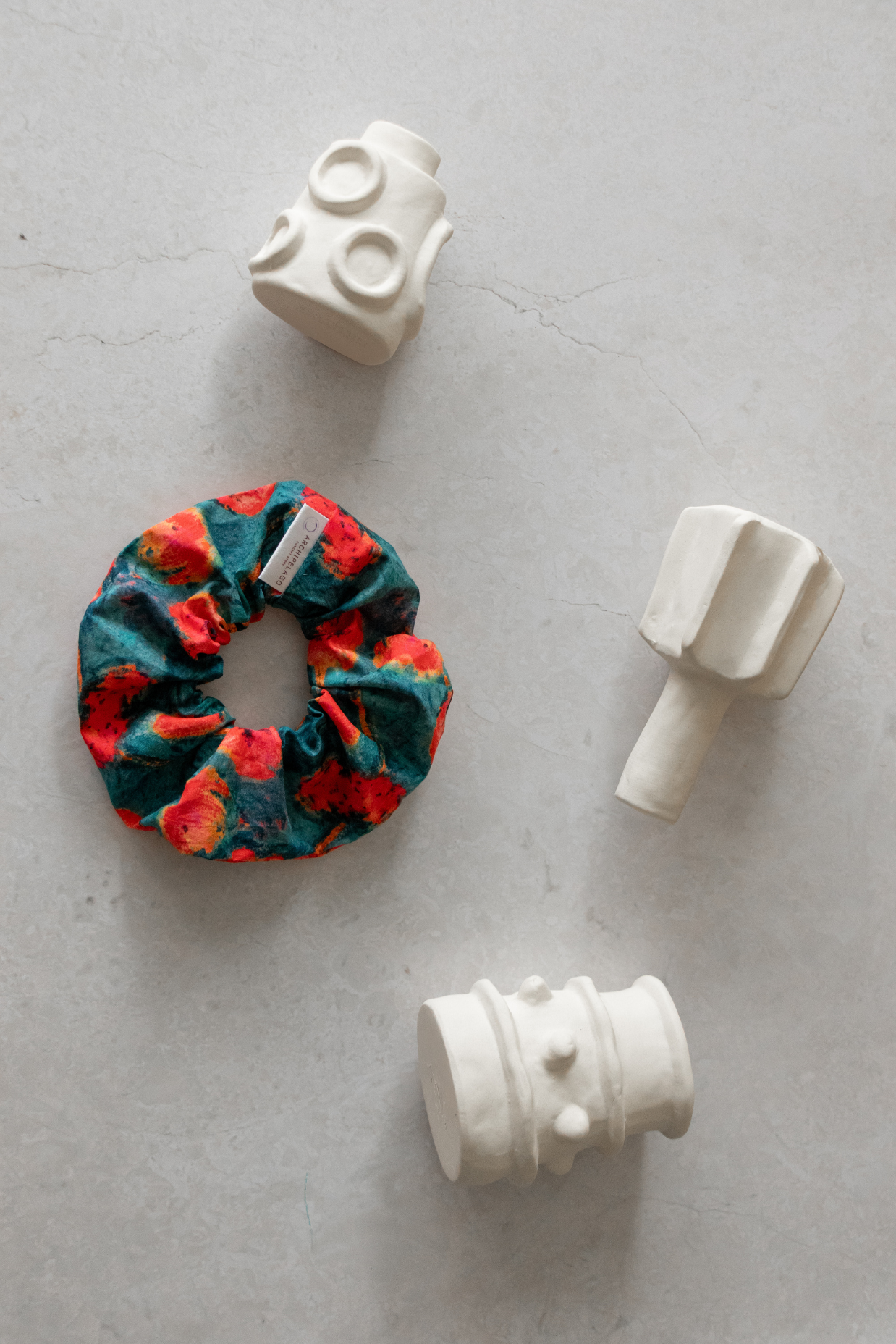Summer Blues scrunchie among ceramic bases